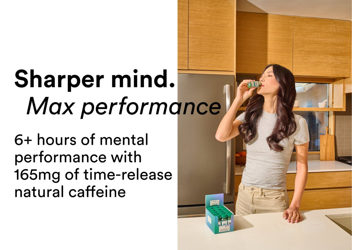 Woman drinking Peak Focus Shot in her kitchen, 165mg time-release natural caffeine